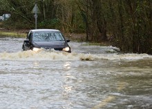 Horley,Surrey/United Kingdom- December 29 2019: The River Mole Has Flooded Its Banks, Cars Are Trying To Drive Through The Flood Waters