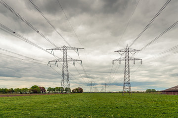 Wall Mural - Dark clouds above the power lines and pylons