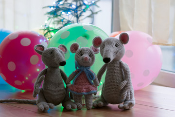 Amigurumi toys dolls posing for the photographer on the background