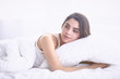 © lenetsnikolai - beautiful young woman basking in bed in the morning. Beautiful