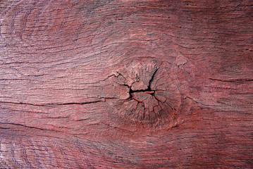 Weathered obsolete rough textured wooden board with knot grunge background.