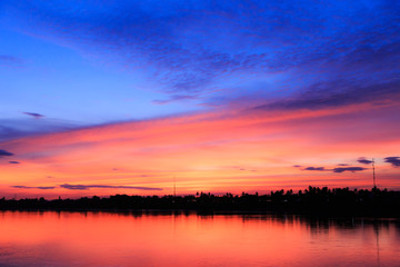Wall Mural - Fantasy abstract twilight dawn background, Gold sunlight on blue sky and moving soft purple clouds above before sunset-Mae khong river, Thailand