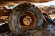 large wheel detail excavator at construction site with mud
