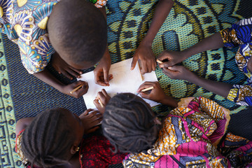 Top Shot of many African black Children Working on School Education symbol