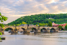 Charles Bridge Karluv Most With Alley Of Dramatic Baroque Statues Over Vltava River In Old Town Of Prague Historical Center, Garden On Slope Of Petrin Hill Background, Czech Republic, Bohemia, Europe