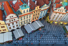 Top View Of Prague Old Town (Stare Mesto) Historical City Centre. Row Of Buildings With Colorful Facades And Red Tiled Roofs On Old Town Square Staromestske Namesti In Evening, Bohemia, Czech Republic