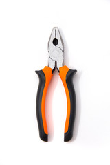 Combination pliers with black and orange handles, isolated over a white background. Tools and hardware for everyday. Construction and repair. Selective focus