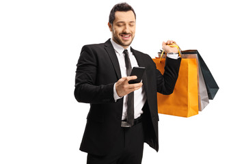 Sticker - Businessman with shopping bags and a smartphone