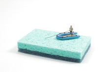  Close Up Of Toy Fisherman On Boat With Copy Space. Fisherman Figurine On Boat.