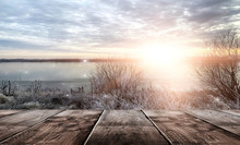 Winter Background. Winter Snow Landscape With Wooden Table In Front. Winter Sun, Ray, Glare. Empty Natural Scene With A Wooden Table.