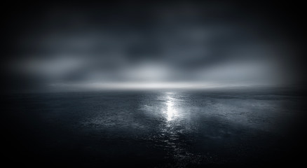 Wall Mural - dark street, wet asphalt, reflections of rays in the water. abstract dark blue background, smoke, sm