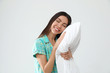 © New Africa - Beautiful Asian woman with pillow on light grey background. Bedtime