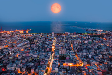 Aufkleber - Mersin City and port at night with full orange moon. 