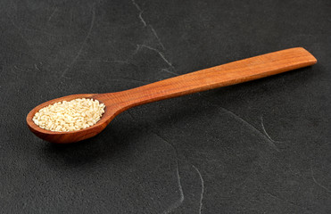 Wall Mural - Sesame seeds in spoon