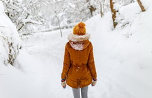 Girl Or Woman Walk In Winter Outdoor, Snowy Cold Weather, Countryside Blizzard Snowfall, Yellow Hat