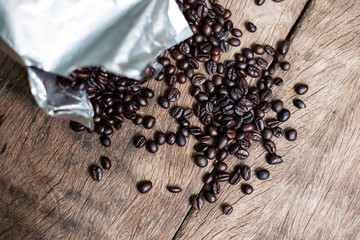 Arabica roast coffee bean spread on wood table