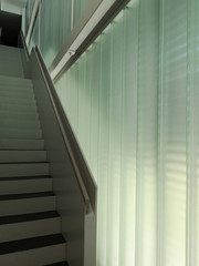 Poster - low angle close-up photo of staircase and semitransparent glass block wall vied in perspective. abst