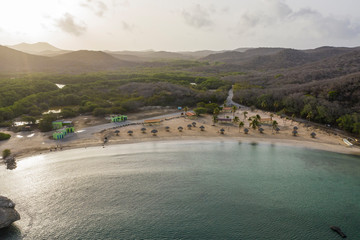 aerial view of coast of curaçao in the caribbean sea with turquoise water, cliff, beach and beautifu