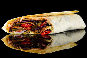 Wall Mural - shawarma in pita bread on a black background