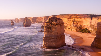 Wall Mural - Twelve Apostles Sea Rocks near Great Ocean Road on the sunset, Port Campbell National Park, Australia. Pink filter