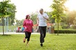 Running smiling mature couple outdoor, sport active lifestyle