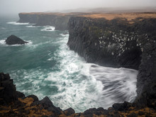 Violent Waves Crash Onto The Rocky Cliffs Of Snaefellsnes Penninsula, Iceland