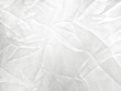 © Nattawut - Soft white wrinkled fabric background