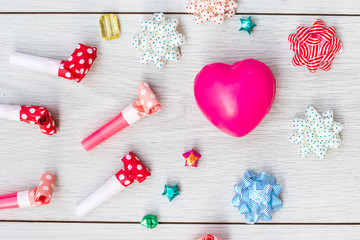 Celebration above various party confetti with pink heart accessories.Christmas concept,with decoration for New Year concept copy space,Top view,flat lay