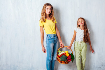 children sit with fresh vegetables healthy eating fruit