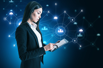 Aufkleber - Businesswoman using tablet with social network interface