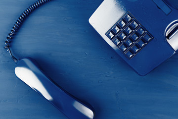 Poster - Retro telephone of blue color on classic blue background