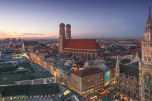 Aerial City View Of Munich Old Town With Skyline Or Cityscape And Main Cathedral In Christmas Time After Winter Sunset Sky.