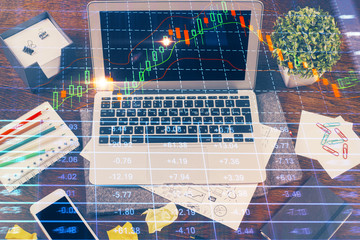 Multi exposure of chart and financial info and work space with computer background. Concept of international online trading.