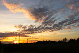 Fototapeta Do pokoju - Mobile phone communication antenna tower with silhouette in sunset sky background