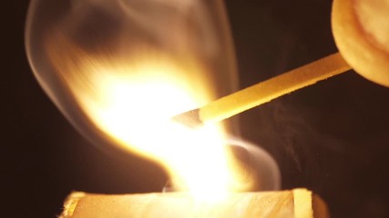 Wall Mural - lighting a match macro shot slow motion