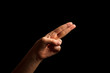 © kseniaso - Hand Showing Sign of H Alphabet in American Sign Language (ASL), isolated on black background. Sign language