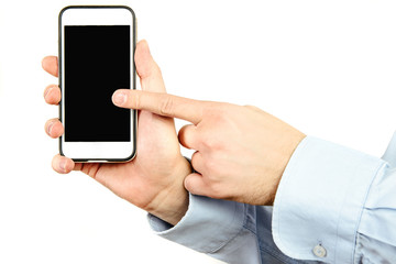 Canvas Print - Phone in hand on a white background. A man holds a phone with a blank display in his hand. The concept of supplementing content, providing information.