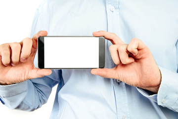 Poster - phone in hand on a white background. a man holds a phone with a blank display in his hand. the conce