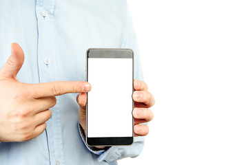 Canvas Print - Phone in hand on a white background. A man holds a phone with a blank display in his hand. The concept of supplementing content, providing information.