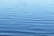 Smooth surface light blue water on Florida river, natural background 