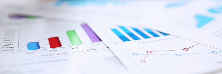 Male hands hold documents with financial statistics