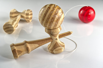 Kendama japanese wooden toy on isolated on white. Wood toy s in black and orange color and traditional bamboo wood