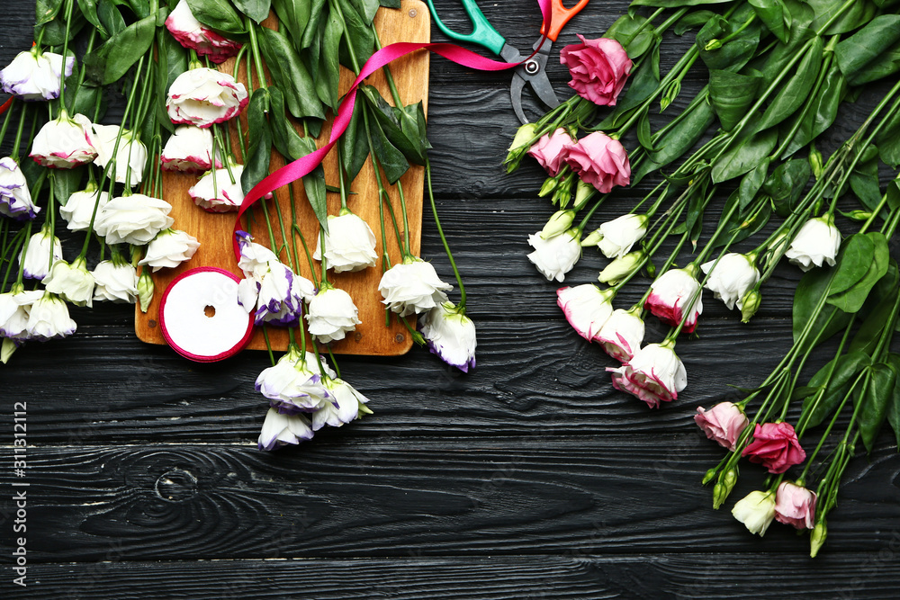 Workplace of professional florist on wooden background
