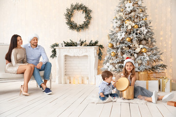 Sticker - Happy family in room decorated for Christmas