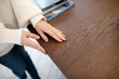 © zinkevych - Close up of womans hands touching the table