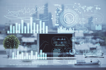 Stock market chart hologram drawn on personal computer background. Double exposure. Concept of investment.