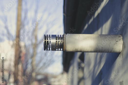 Fotomural White coaxial chimney sticking out of a gray wall