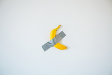 A Banana Taped To The White Wall.