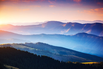 Canvas Print - Calm evening landscape in the mountains at sunset.