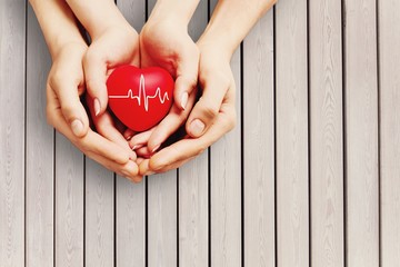 Poster - Man and woman holding red heart